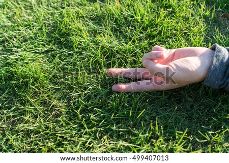 Peace sign on the green field