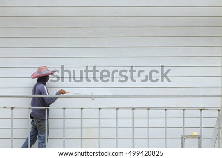 Male workers painted outdoors