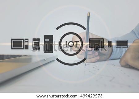 Internet of things.Radio Frequency identification. Information Technology.Close-up of a black pencil in a man's hand. Businessman takes notes in pencil on schedule.The image on white background.