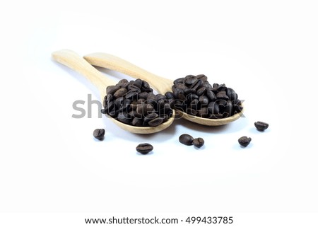 Coffee beans on wooden spoon white background.