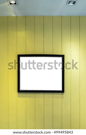 Photo frame on wood wall background