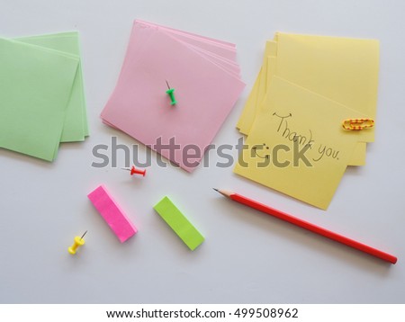  Word "Thank you" on sticky note.         