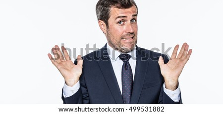 smiling careless bearded businessman refusing accusation, acting like an hypocrite, coward or irresponsible for corporate faults, isolated, white background Royalty-Free Stock Photo #499531882