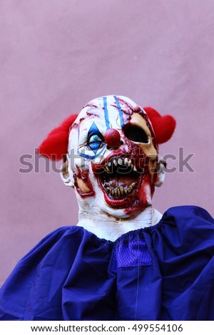Close up Halloween party horror clown. The scary clown standing.closeup of a scary evil clown.closeup of a scary evil clown.