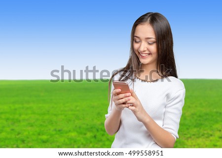 pretty female teenager using smartphone 