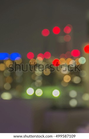 Out of focus of electric light from high building in night and big city, Japan.