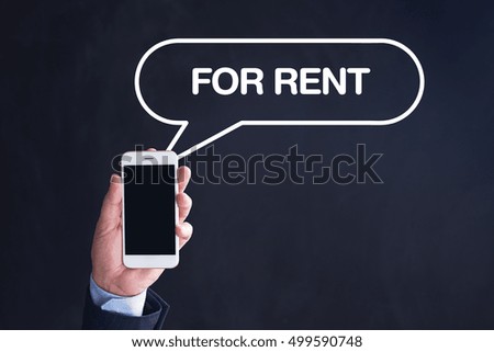 Hand Holding Smartphone with FOR RENT written speech bubble