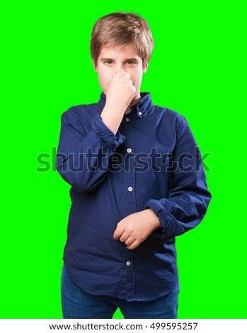 little boy smelling something
