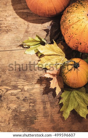 Pumpkin on a wooden table and black background