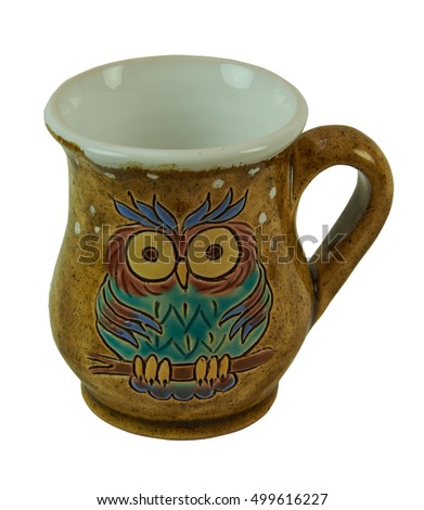 Mugs - pottery handmade from clay.  Decorated with patterned owls. Isolated on a white background
