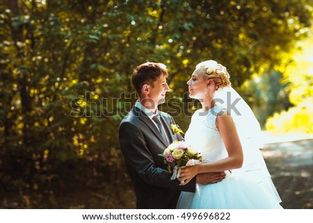 bride and groom on the forest background.
