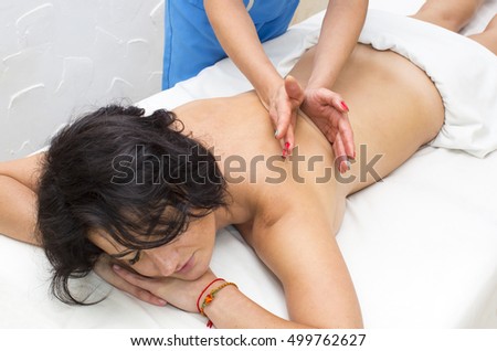young girl doing a massage in the beauty salon