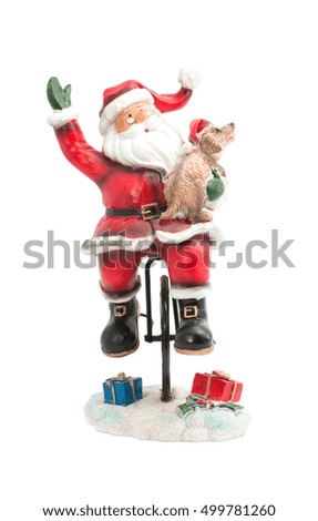Statuette of Santa Claus on a bike with a dog, Happy New Year