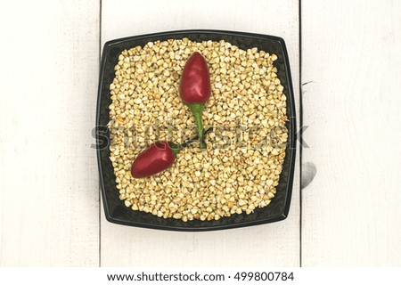 top view of green sprouts buckwheat and red pepper