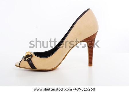 High heel shoe. Beige high heels isolated white.