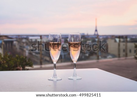 drinking champagne in luxurious restaurant in Paris, France