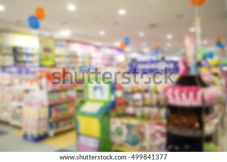 Supermarket abstract blur background. Shopping mall defocused photo for banner template or backdrop. Festive season bokeh. Shopping displays with sweets in blur. Modern supermarket blurry picture