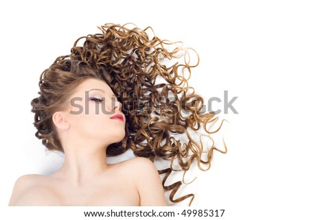 Portrait of the beautiful woman with long curly hair