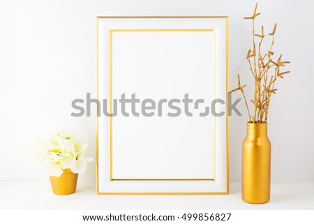 Frame mockup with ivory hydrangea in the golden flower pot. Poster empty white frame  mock up for presentation artwork.