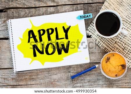 Apply now /. Notebook with apply now and sticker today on wooden desk with cup of coffee and muffin
