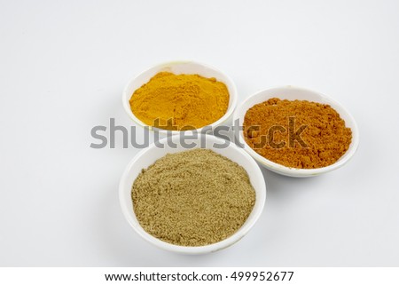 Indian spices in pots on white background, top view mix indian spices and herbs difference ware on white background with copy space for design vegetables, spices, herbs or foods content.