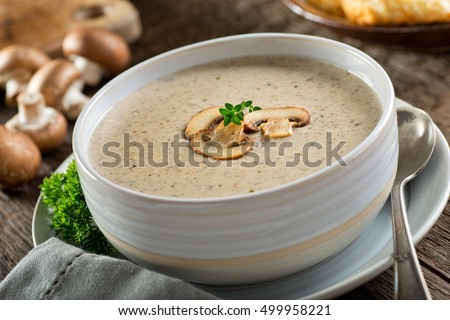 A bowl of delicious homemade cream of mushroom soup. Royalty-Free Stock Photo #499958221