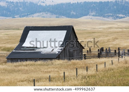 blank sign on old barn