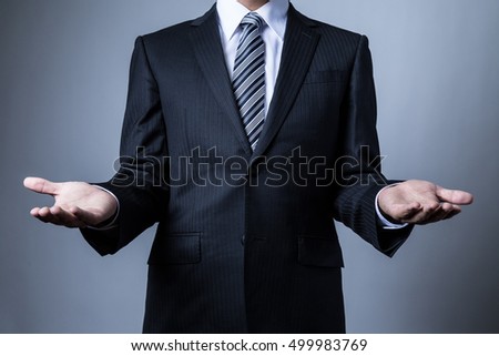 Businessman wearing a suit, welcome, accept, host, guest, hotel, customer, customer
