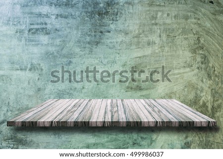 Empty top wooden shelves on grey cement wall. For product display