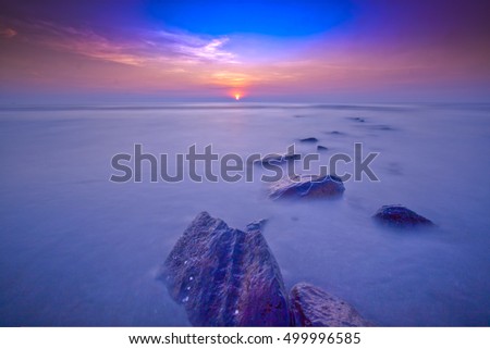 Sunrise seascape at Batu Hitam beach, Pahang. Soft focus due to long exposure shot. Nature composition.