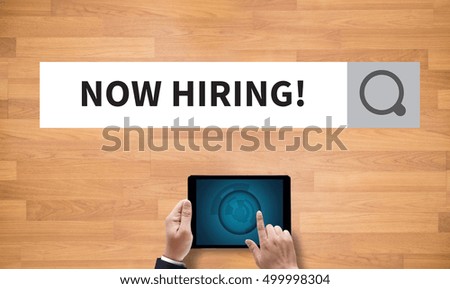 NOW HIRING! , on the tablet pc screen held by businessman hands - online, top view