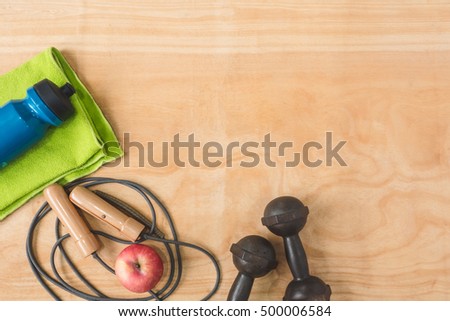 Top view of Sport stuff on wooden table background, Fitness lifestyle concept, Free space for text
