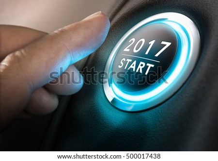 Hand about to press a 2017 button. Concept of new year, two thousand seventeen. Composite between a photography and a 3D background. Horizontal image Royalty-Free Stock Photo #500017438