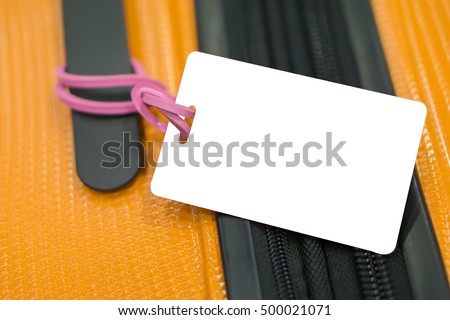 Close up of blank luggage tag label on suitcase or bag with TRAVEL INSURANCE ,Can be used for montage or display your products,selective focus,vintage color