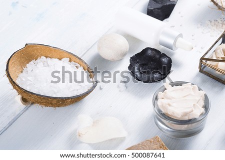 beauty and spa products on white wood table