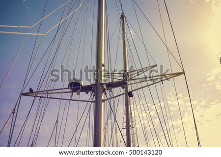 Yachting sail mast detail on sunny sky background. Romantic adventure book cover idea design