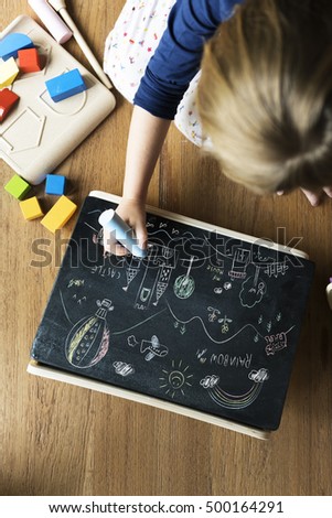 Little Girl Drawing Blackboard Concept