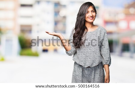latin woman holding something