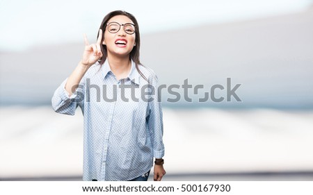 asian woman doing rock gesture