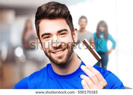 young man holding credit card