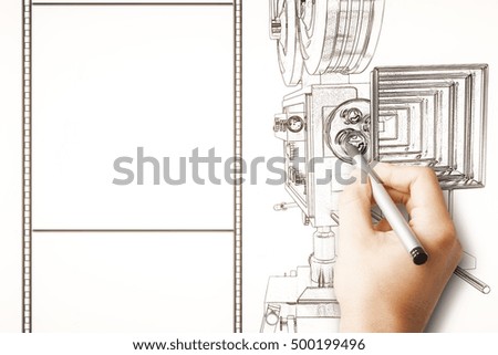 Male hand drawing old style movie camera and blank film strip. Mock up