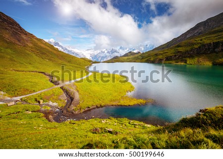 Great view of Mt. Schreckhorn and Wetterhorn above Bachalpsee lake. Dramatic and picturesque scene. Popular tourist attraction. Location Swiss alp, Bernese Oberland, Grindelwald, Europe. Beauty world