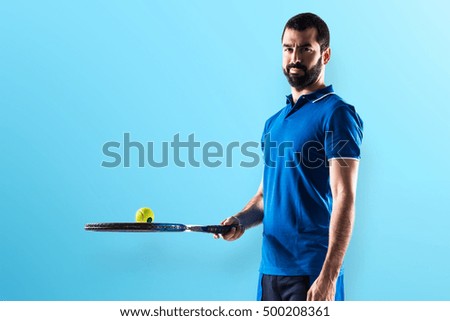 Tennis player over colorful backgound