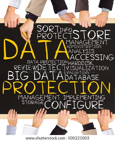 Photo of business hands holding blackboard and writing DATA PROTECTION concept
