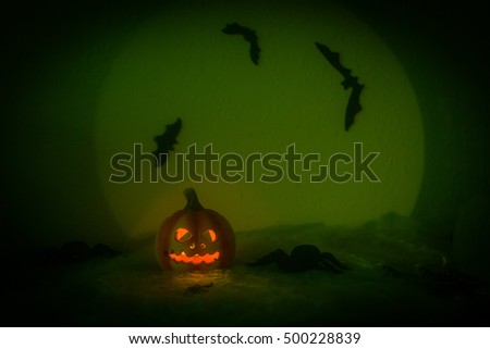 Spooky Halloween Night,,halloween pumpkin, and many flying bats on abstract background with big moon and spiders