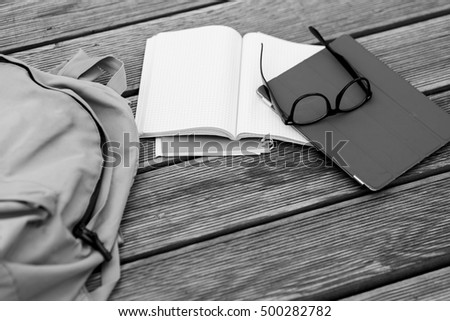 Subjects student -glasses, notebooks, Tablet,black -white photo