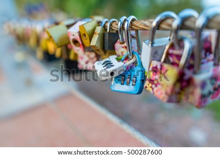 Locks of love - symbol for everlasting friendship.Select focus on blur background.