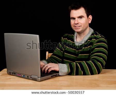 photo casual male on laptop with black screen drop