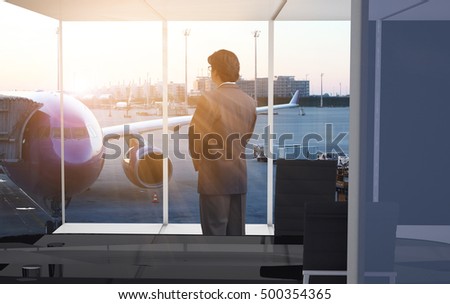 Businessman looking airplane through window,man standing at office and looking forward in the future for making ideas concept or decision some things , use for advertising or business  ideas