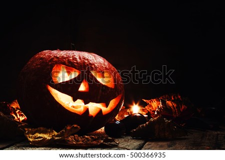 Halloween pumpkin, dark wooden background, selective focus